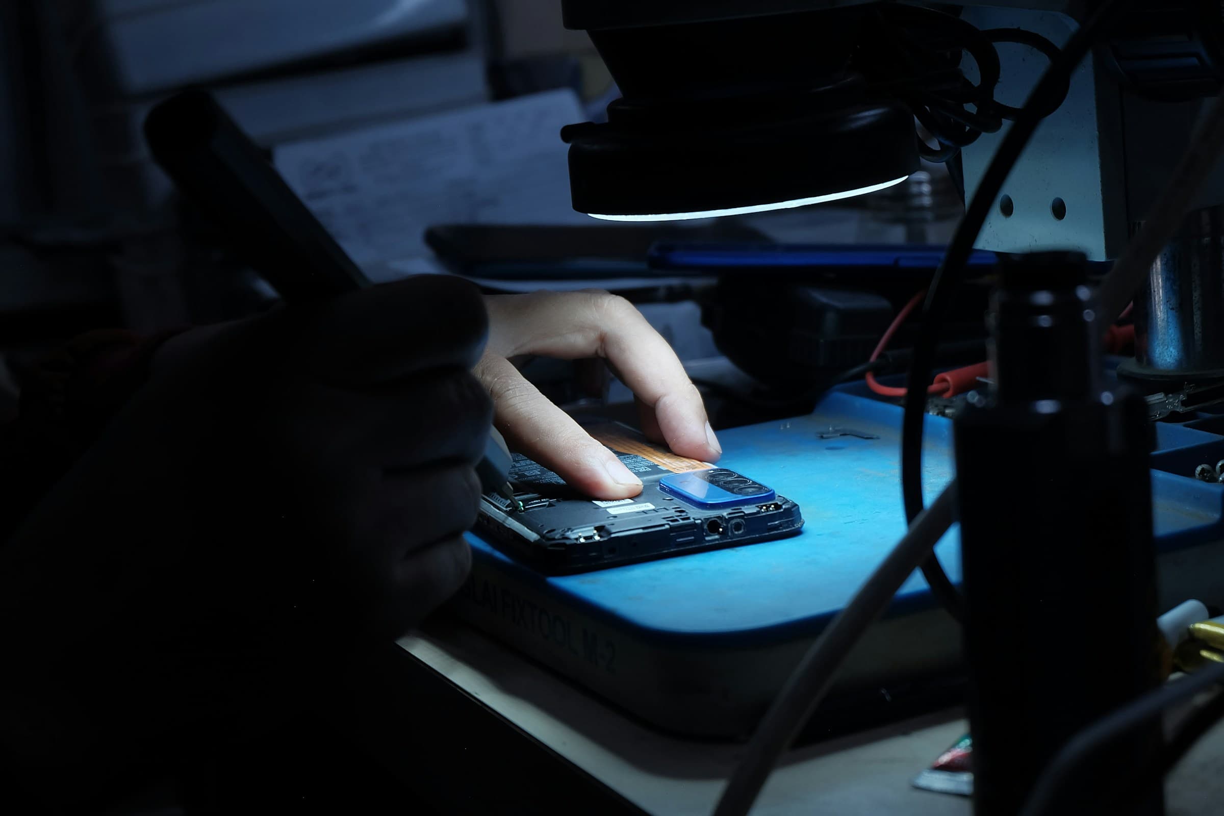 Technician at the BTS Lab bench